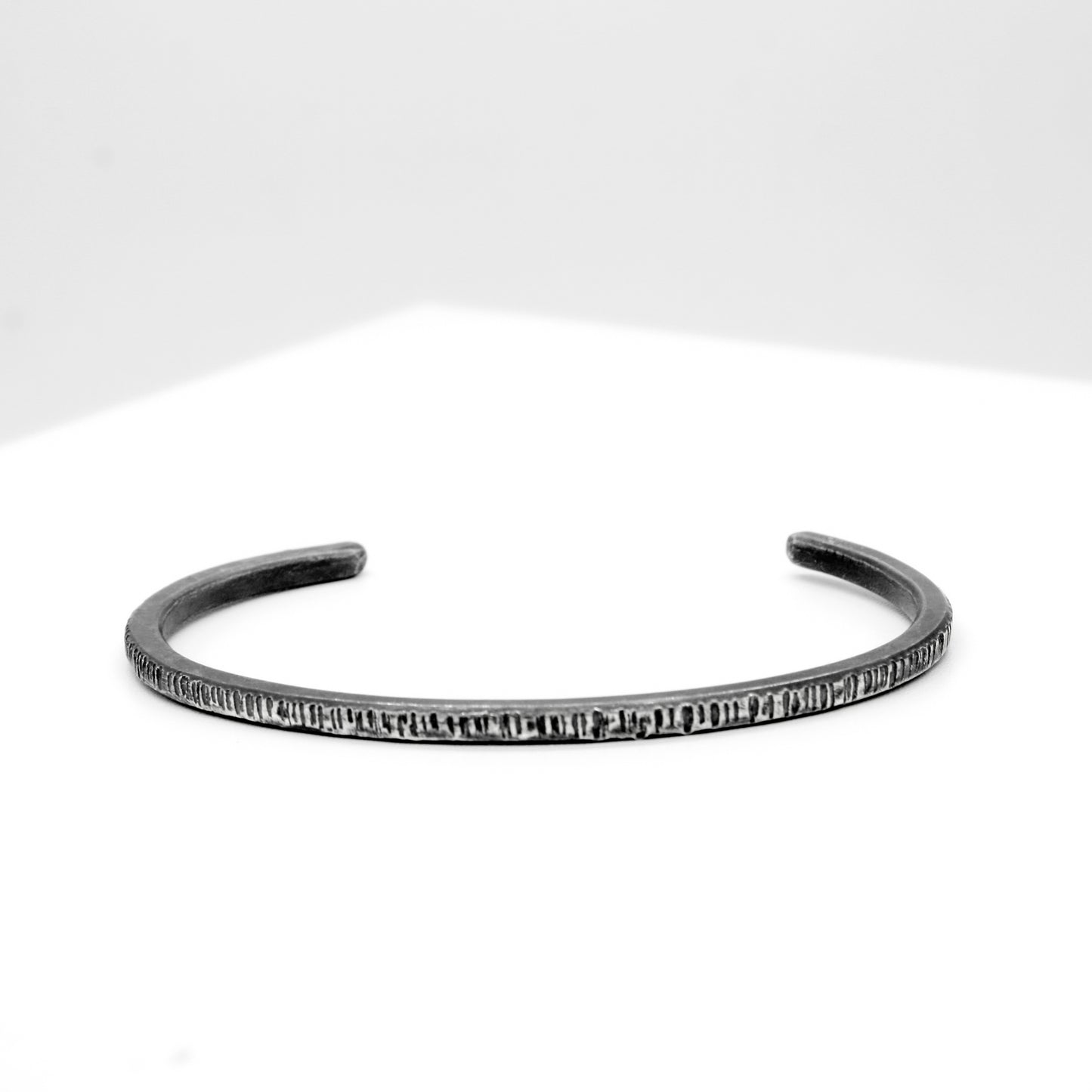 PULSERA DE PLATA NEGRA A RAYAS - N.AG/192