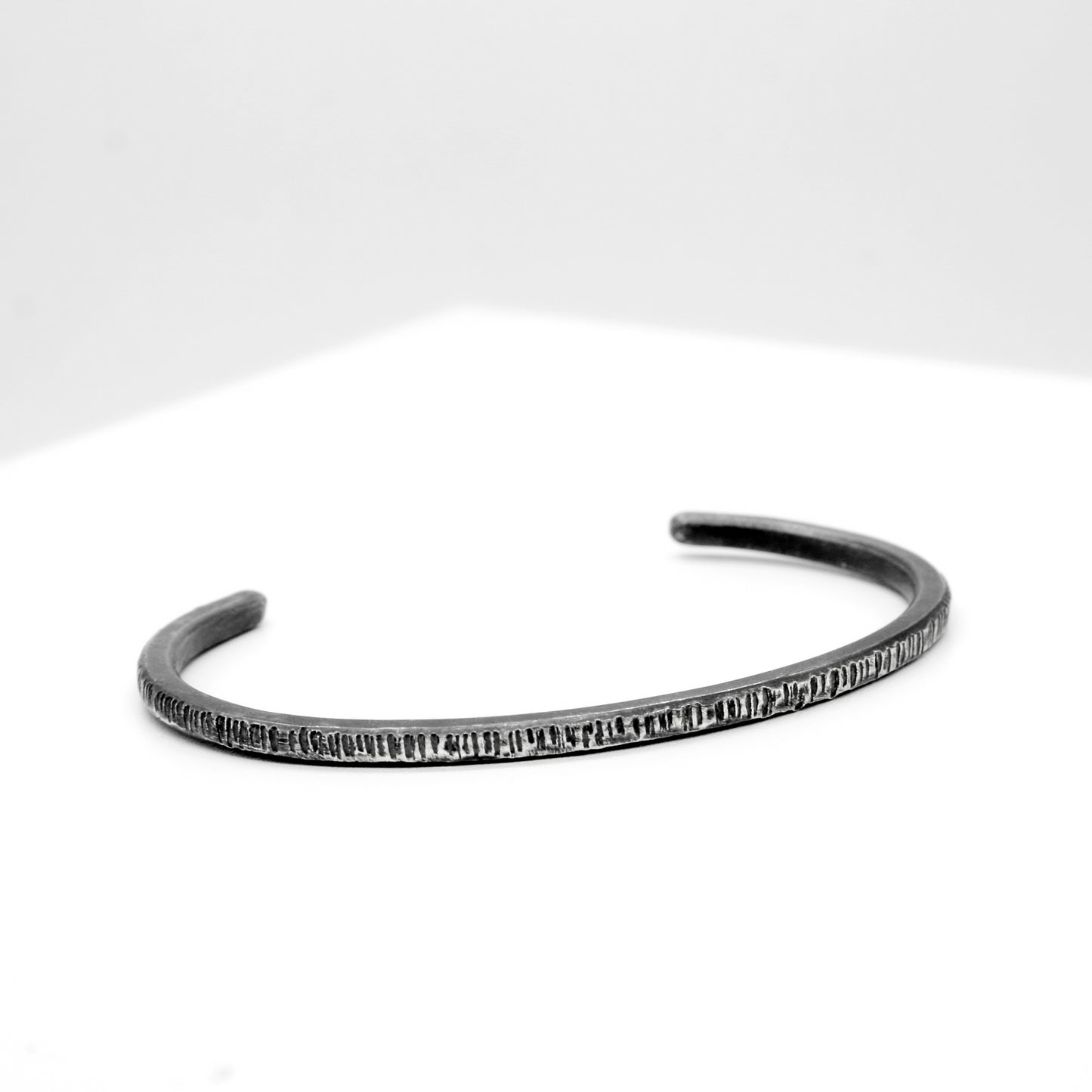PULSERA DE PLATA NEGRA A RAYAS - N.AG/192